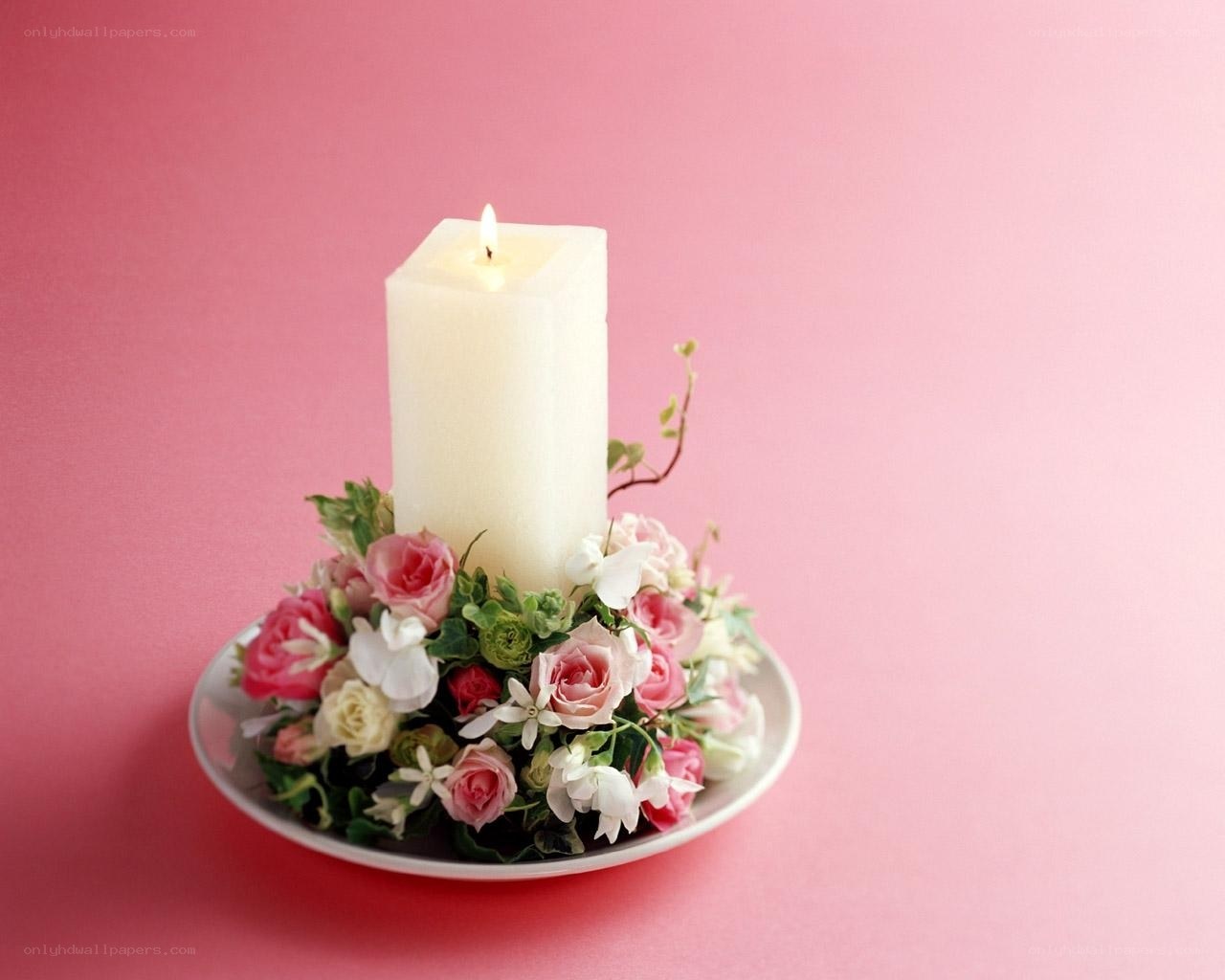 Candle with floral arrangement