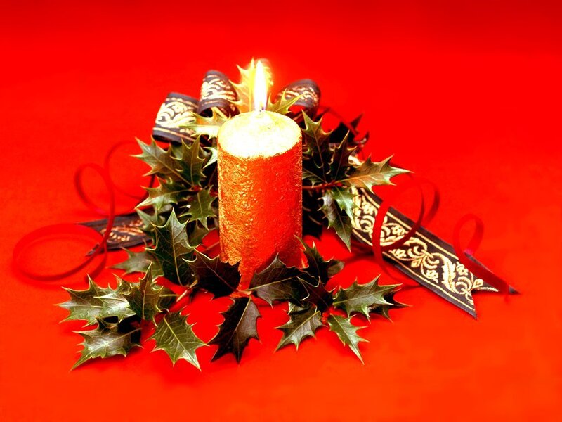 candle with holly wreath