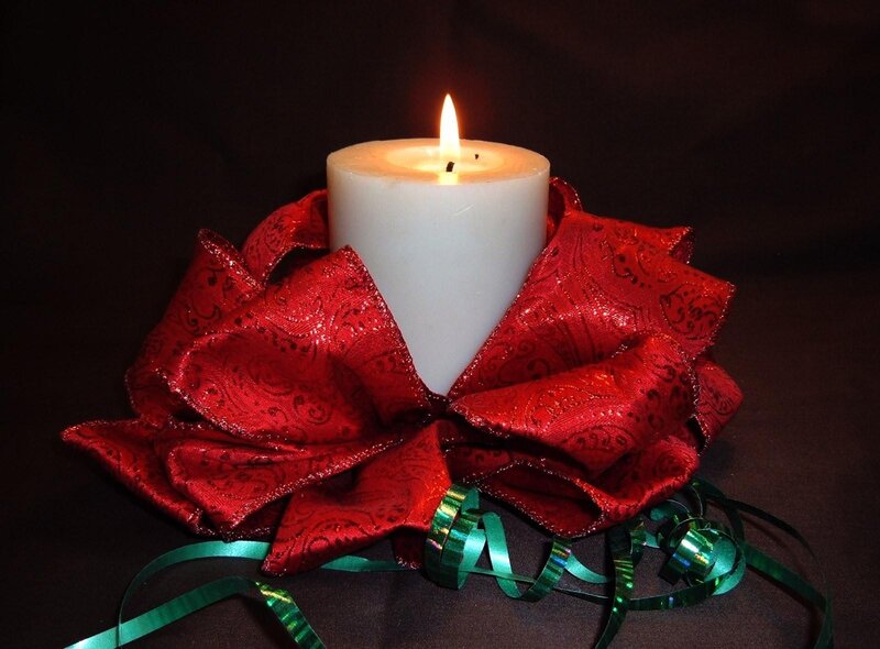 candle with red bow