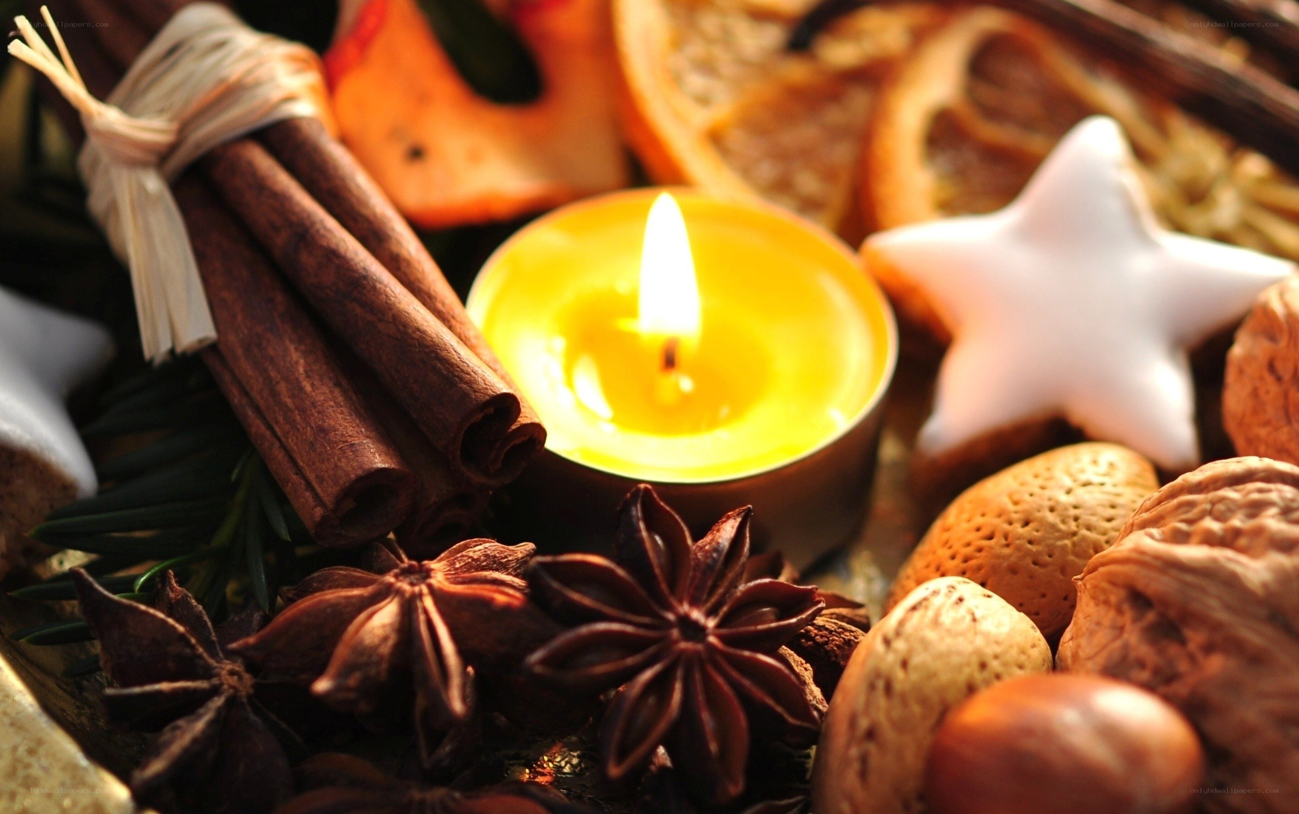 Candle with spices and nuts