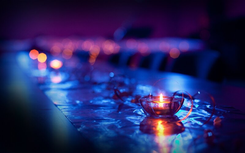 Candlelight on a reflective table