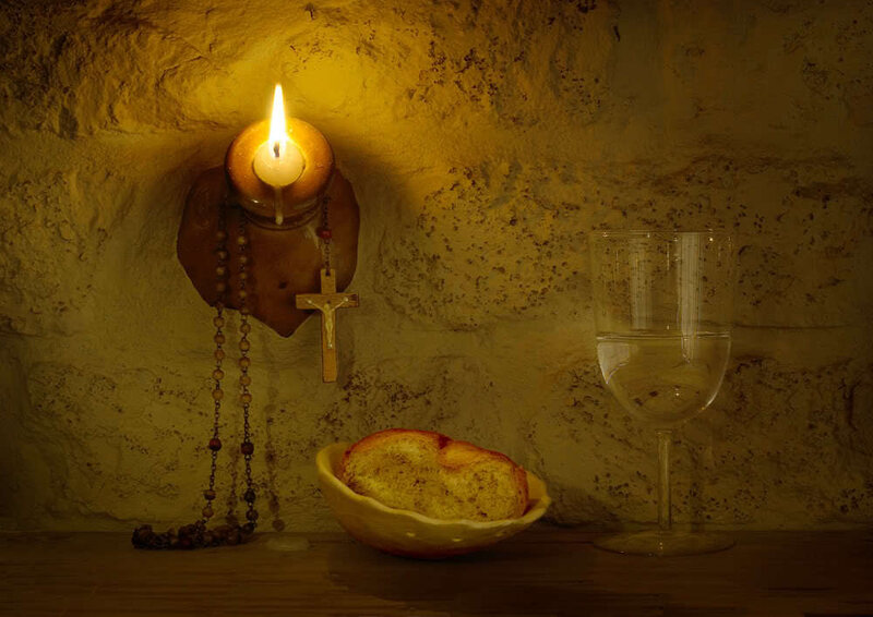 Candlelight with bread and wine