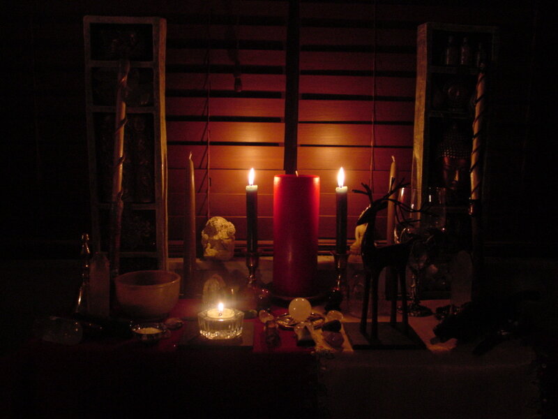 Candlelit altar with crystals