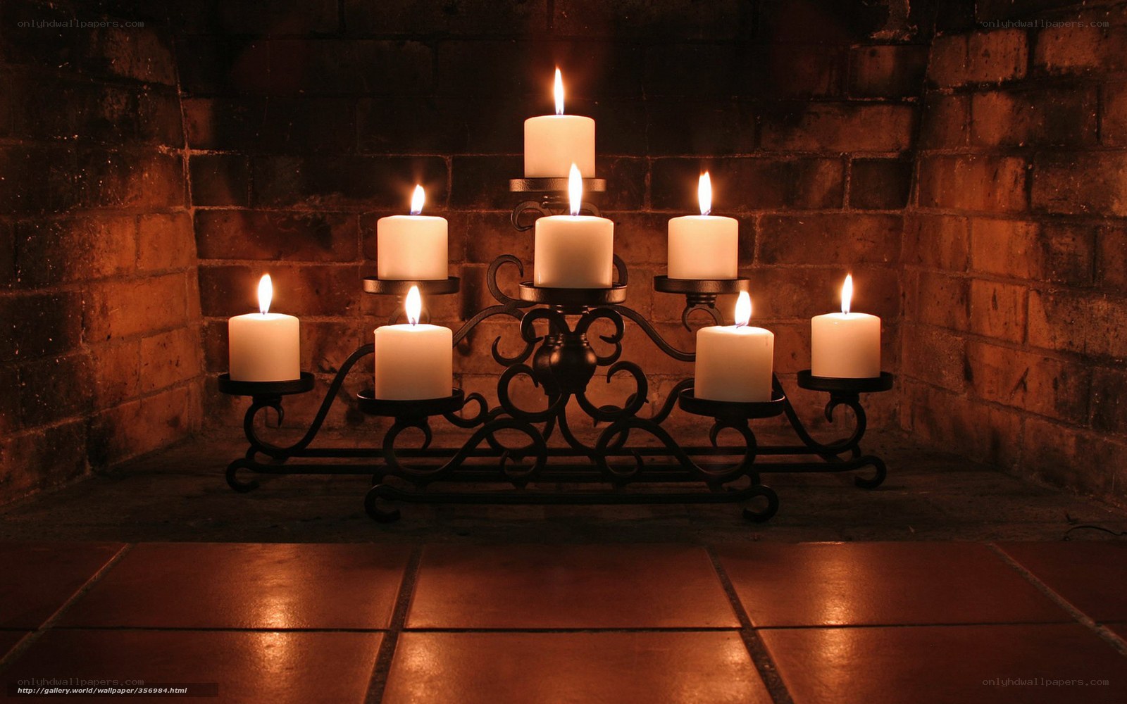 Candlelit candelabra in fireplace