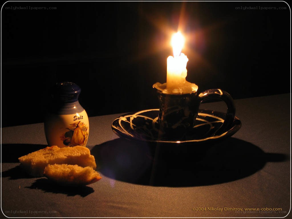 Candlelit still life with bread