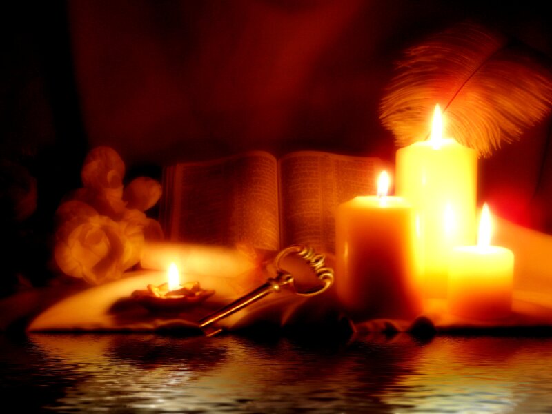 Candles and Book on Water
