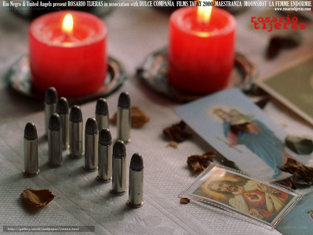 Candles and bullets with religious cards