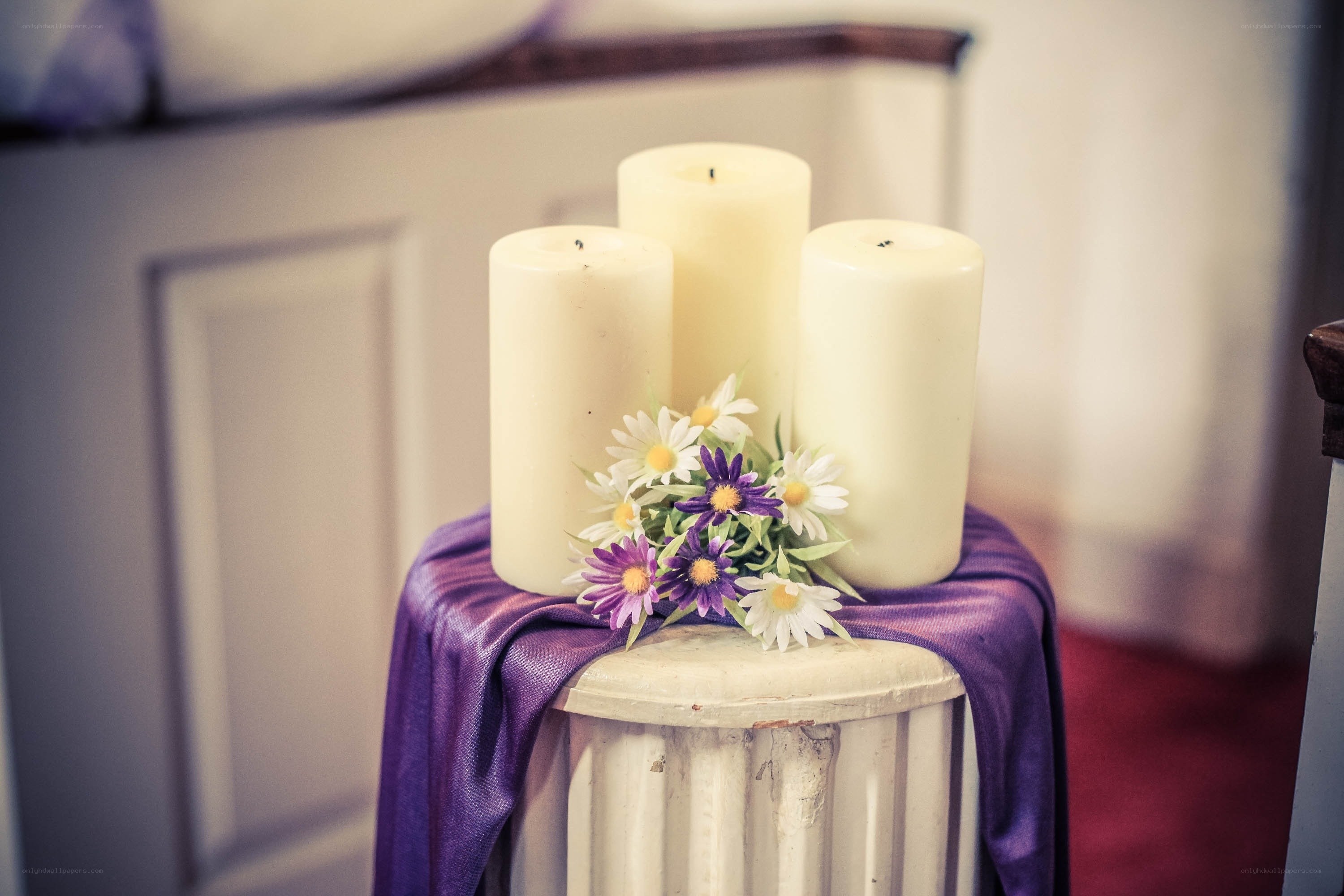 Candles and flowers on a stand