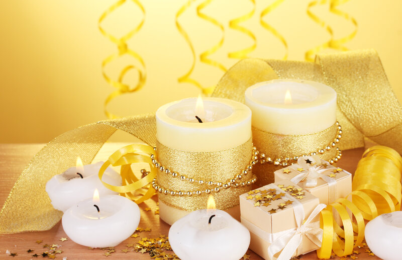 Candles and Gifts on Table — Gold
