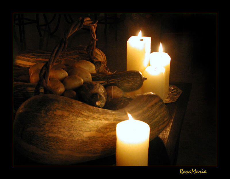 Candles and gourds in dim light