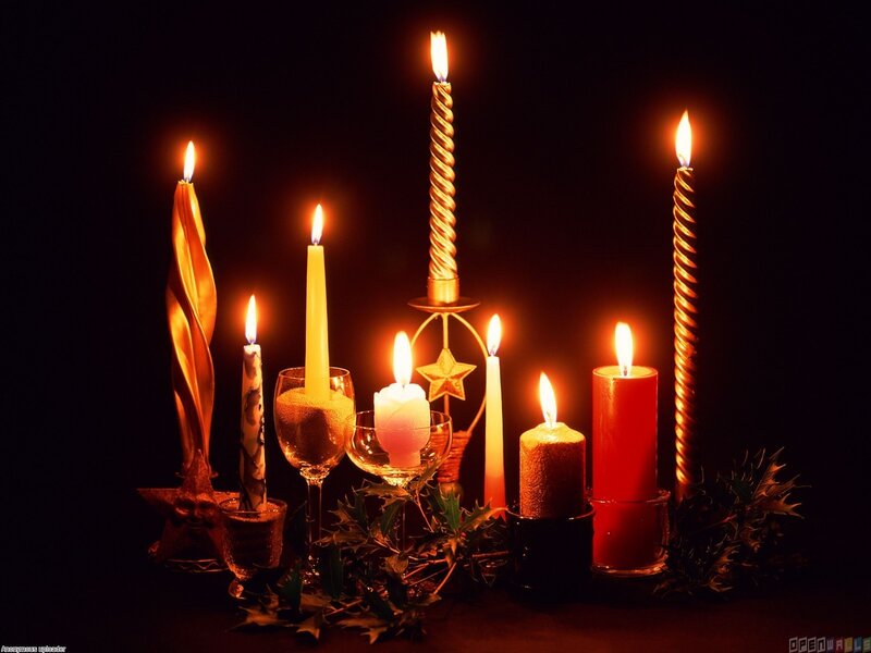 Candles and Holly on Dark Surface