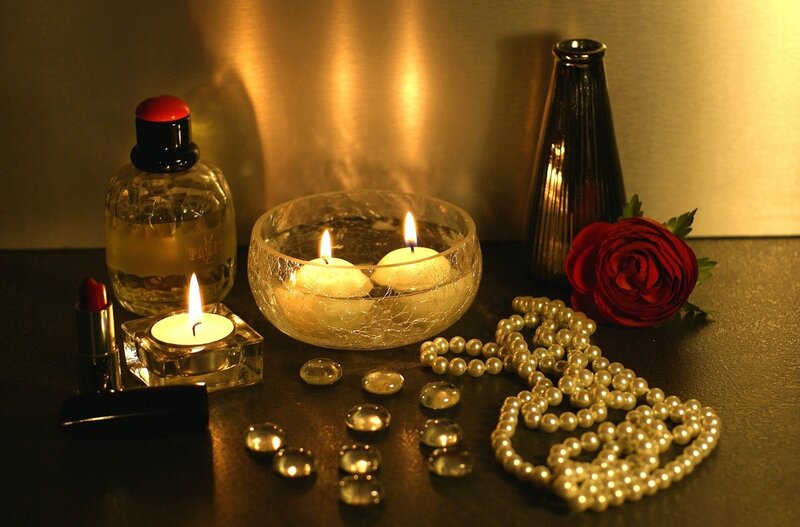 Candles and Jewelry on Table