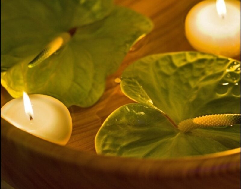 Candles and leaves in water