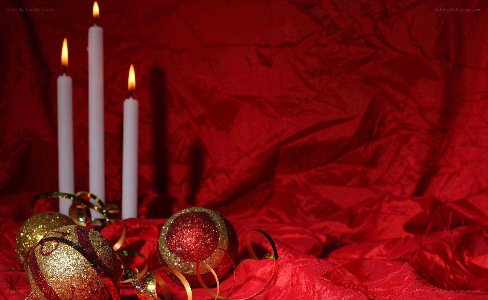 candles and ornaments on red