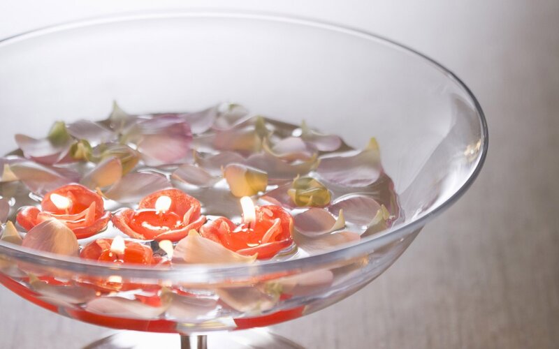 Candles and petals in a bowl