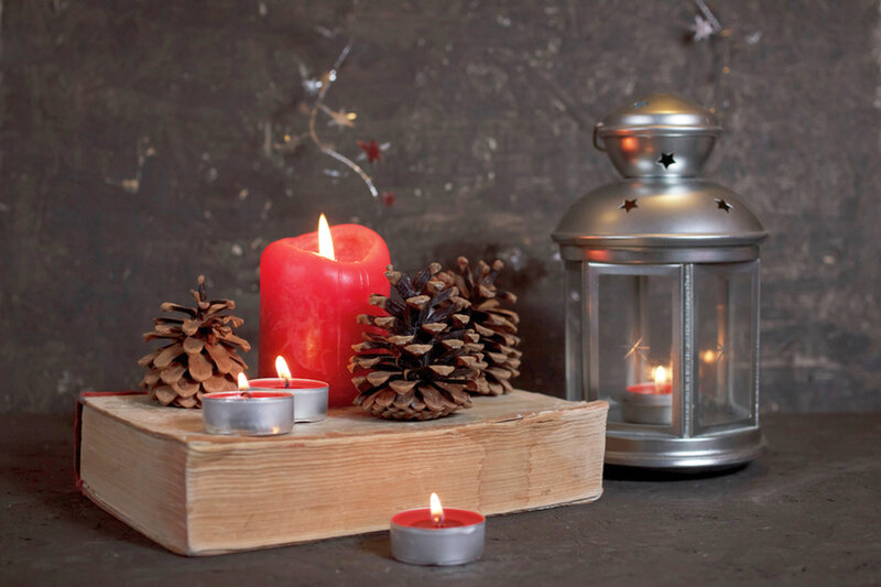 Candles and Pinecones on Book