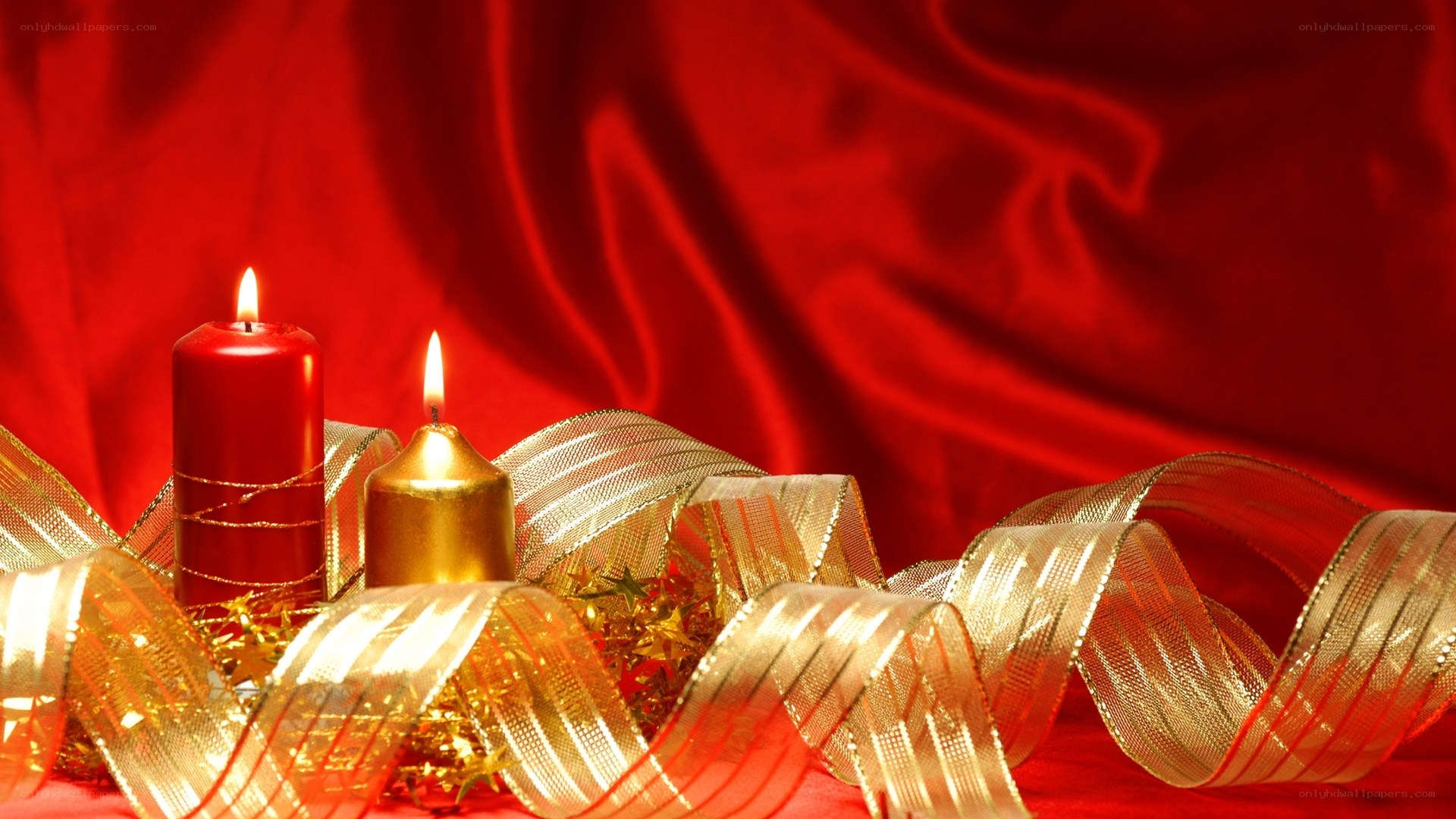 Candles and ribbons on red cloth