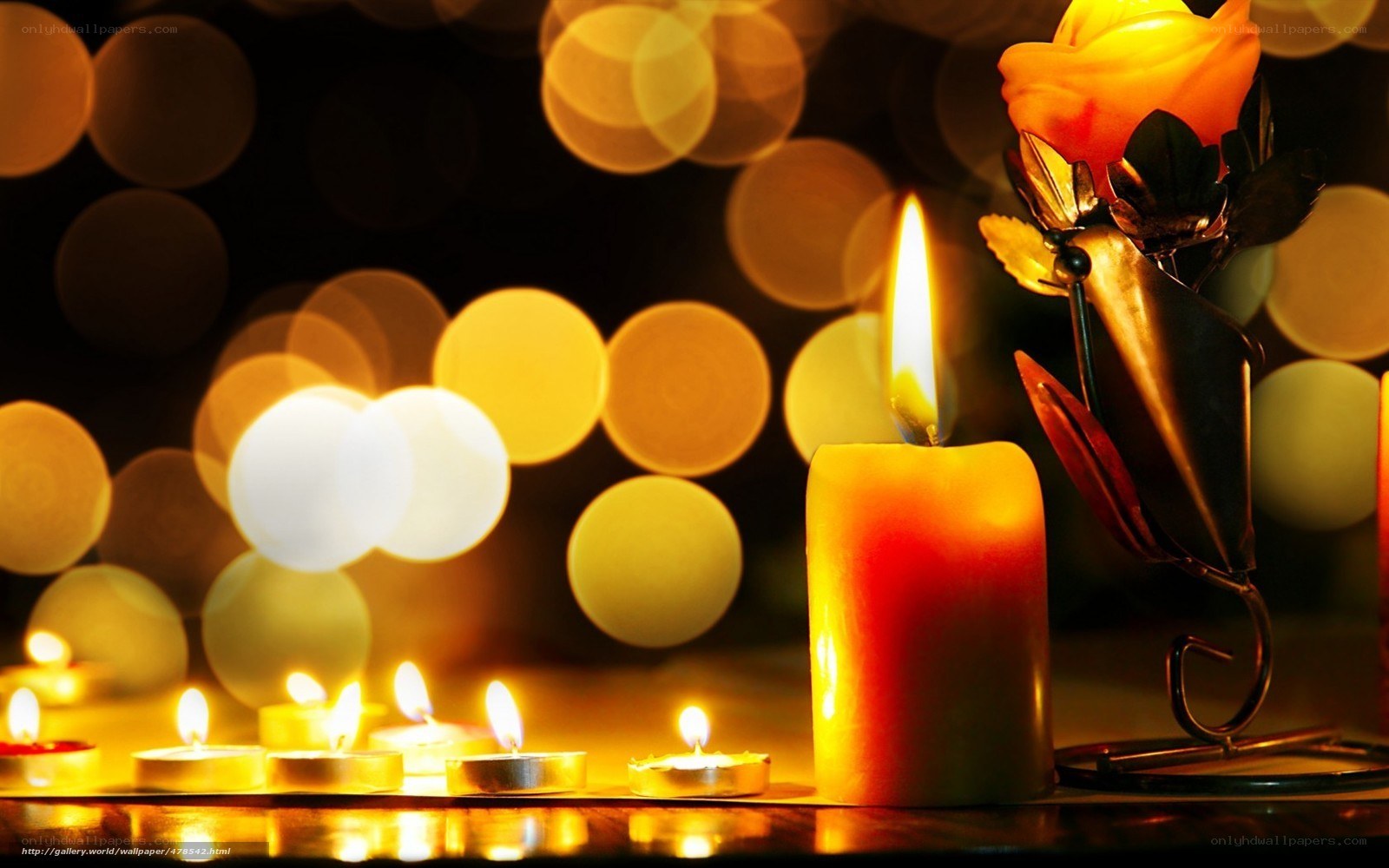 Candles and rose in warm light