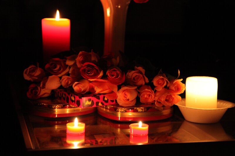 candles and roses on table