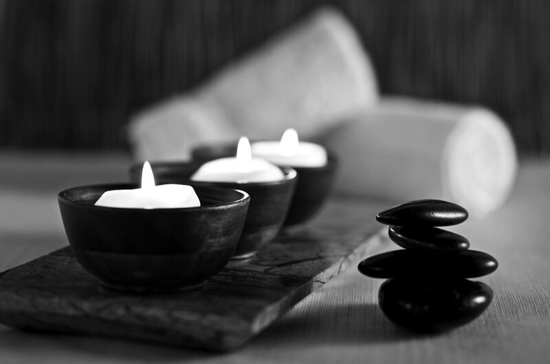 Candles and Stacked Stones