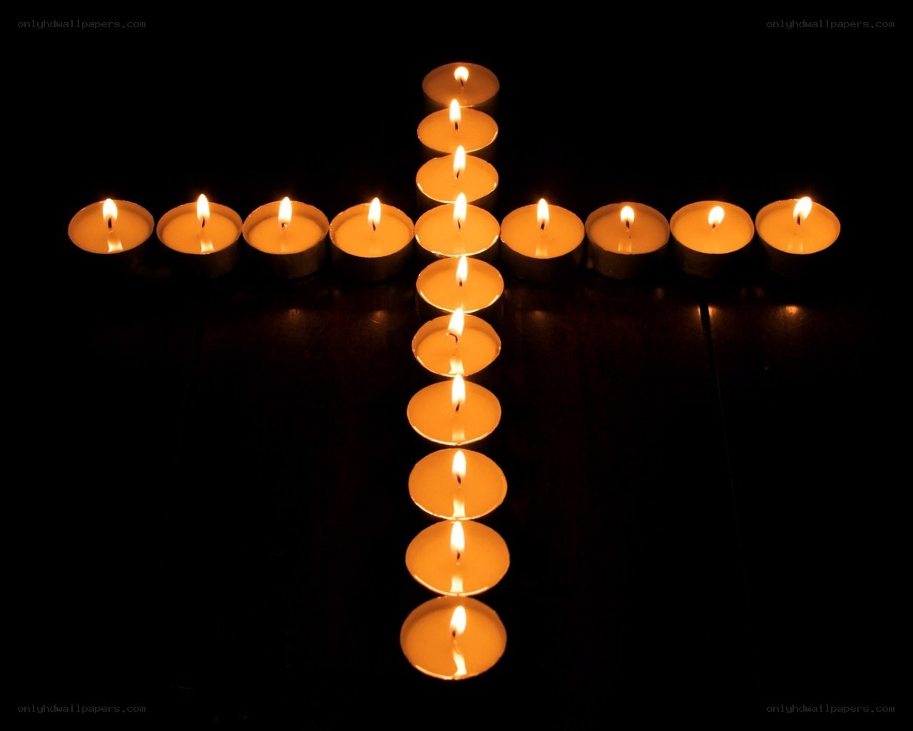 Candles arranged in a cross