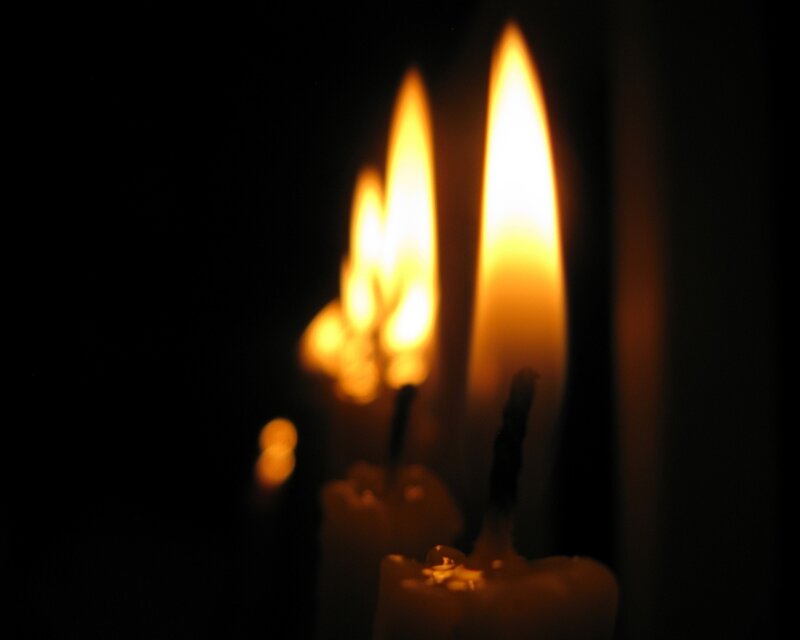 Candles Burning in Dark