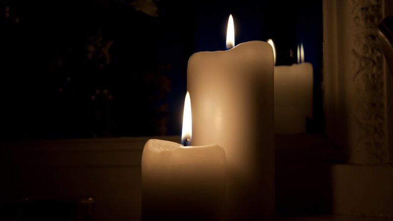 Candles Burning in Dark — White