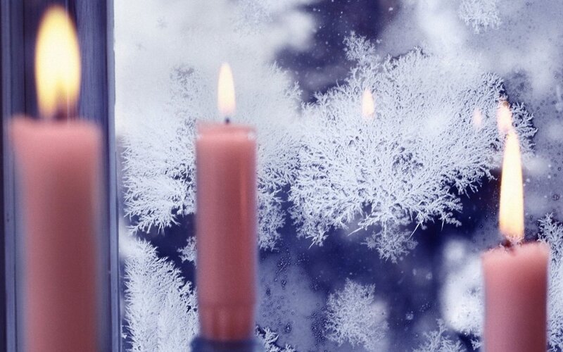 Candles by Frosty Window