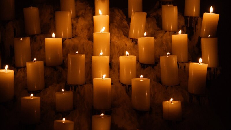 Candles in a dark cave