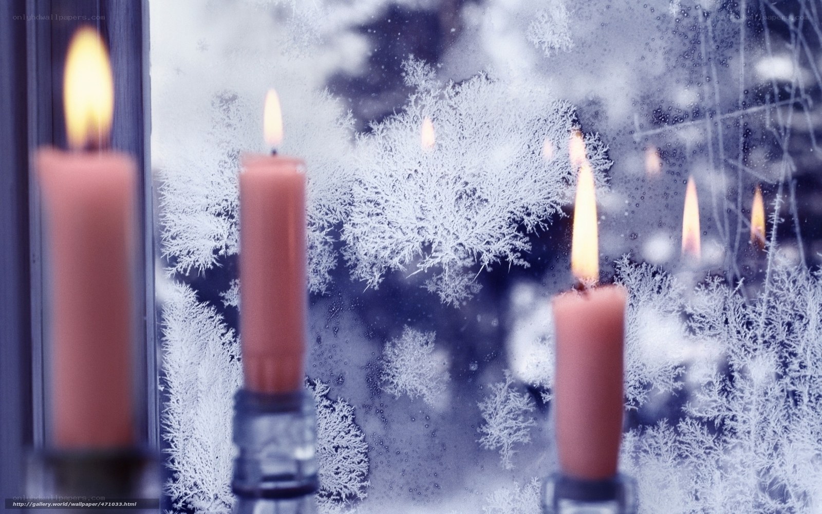 Candles in a frosty window