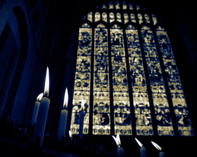 Candles in Front of Stained Glass