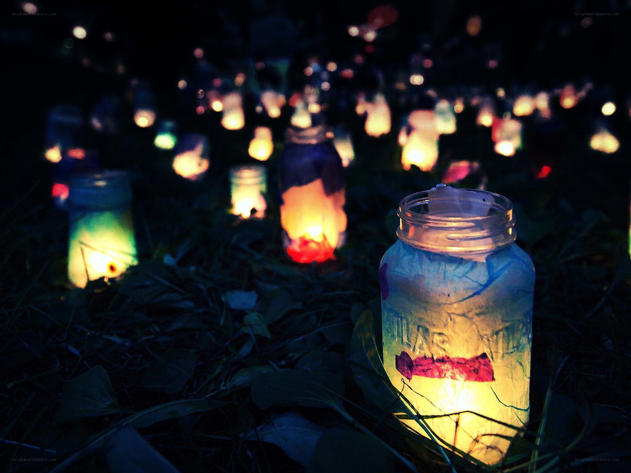 Candles in jars at night