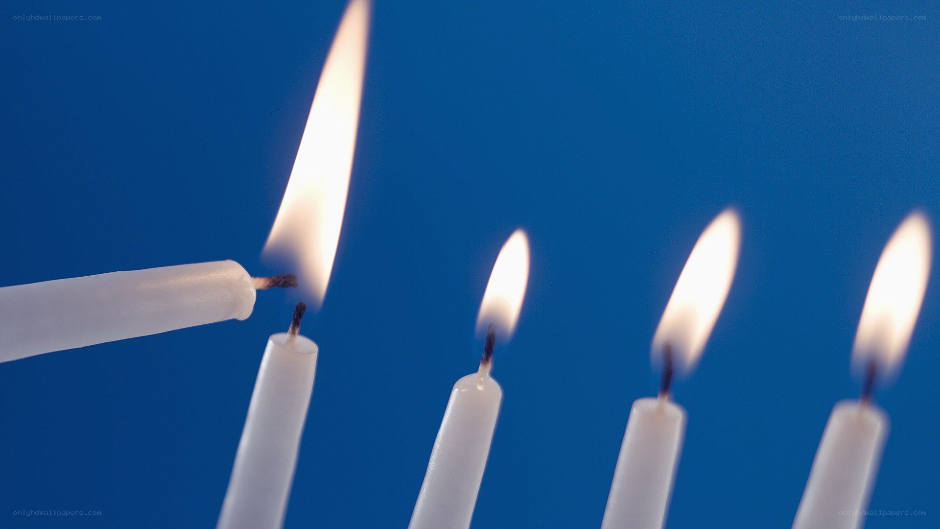 candles lit against blue
