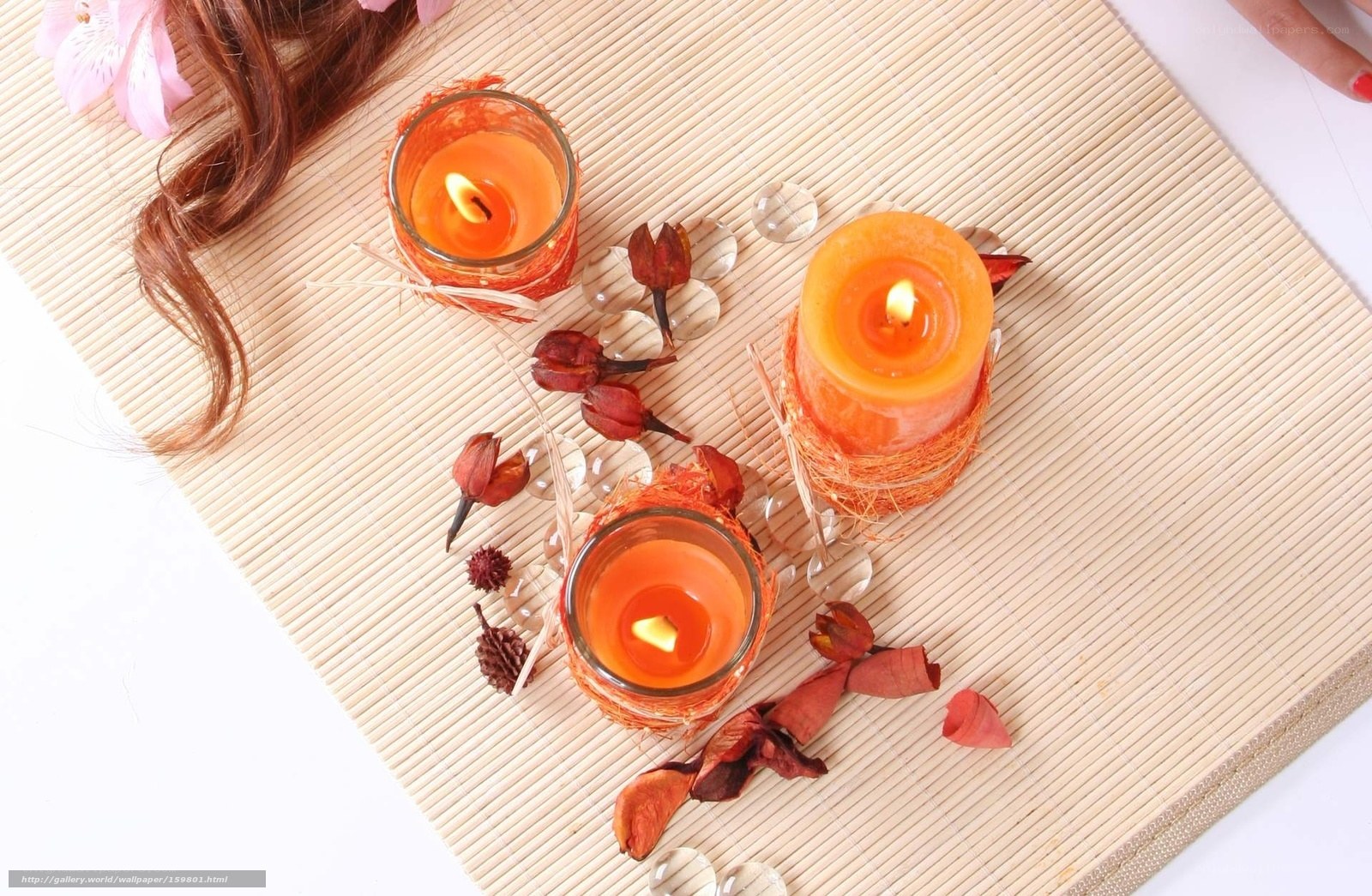 Candles on bamboo mat