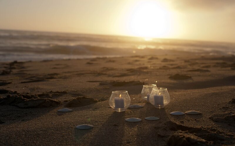 Candles on Beach at Sunset