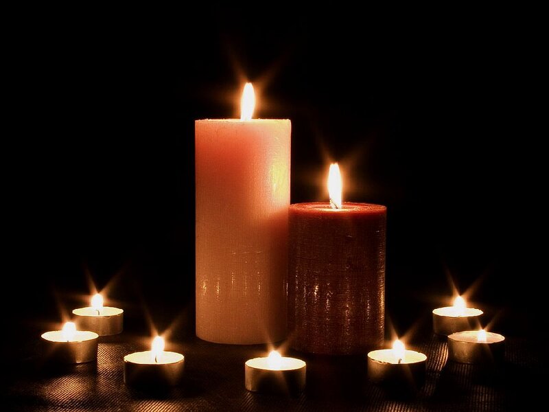 Candles on Dark Surface