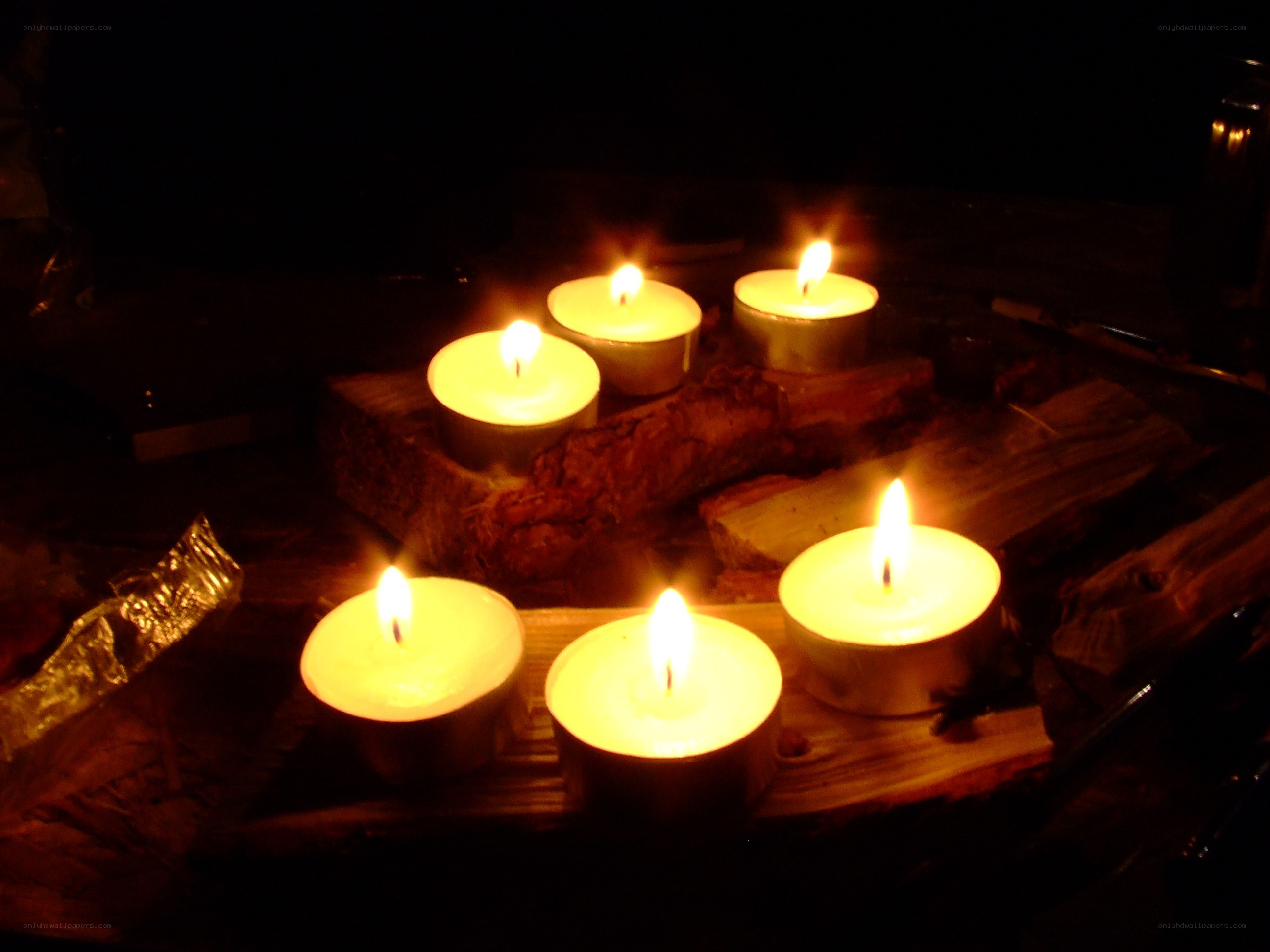 Candles on wood logs
