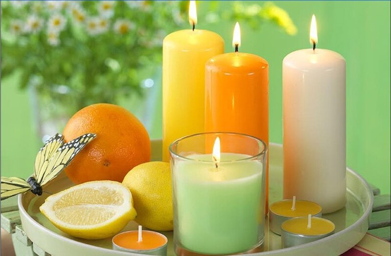 Candles with citrus fruits