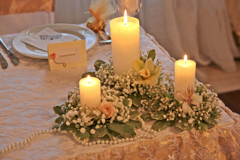 Candles with Flowers on Table