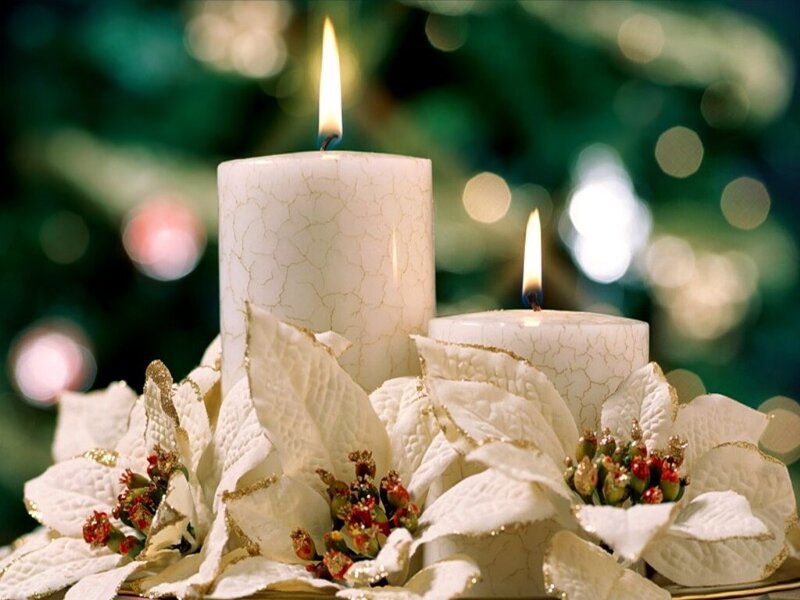 Candles with poinsettias