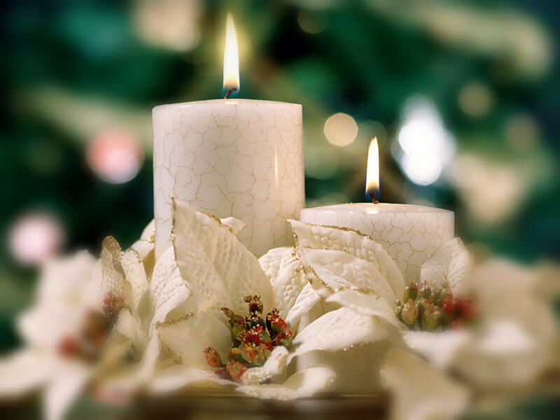 Candles with poinsettias