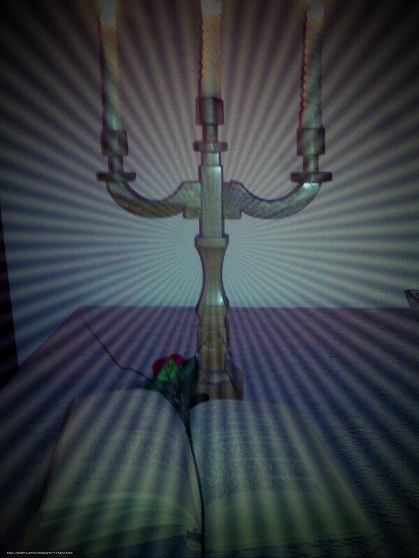 candlestick on open book