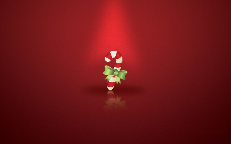 Candy cane on red background
