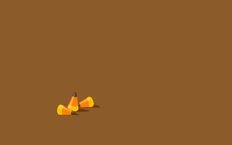 candy corn on brown background