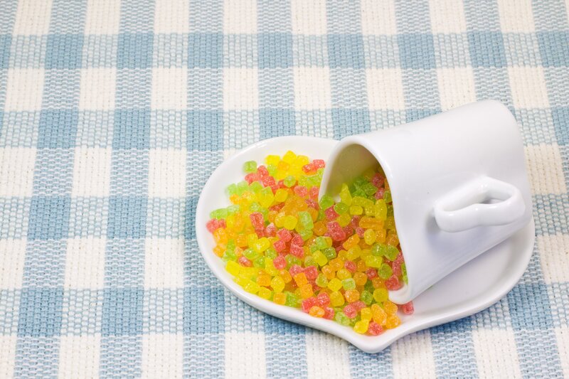 Candy spilling from a cup