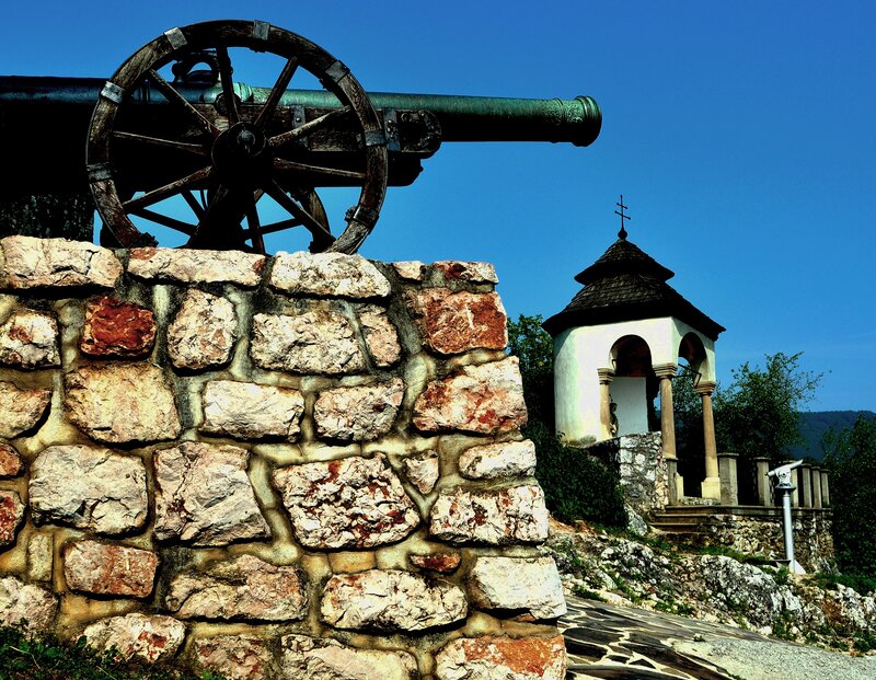 Cannon and chapel on a hill