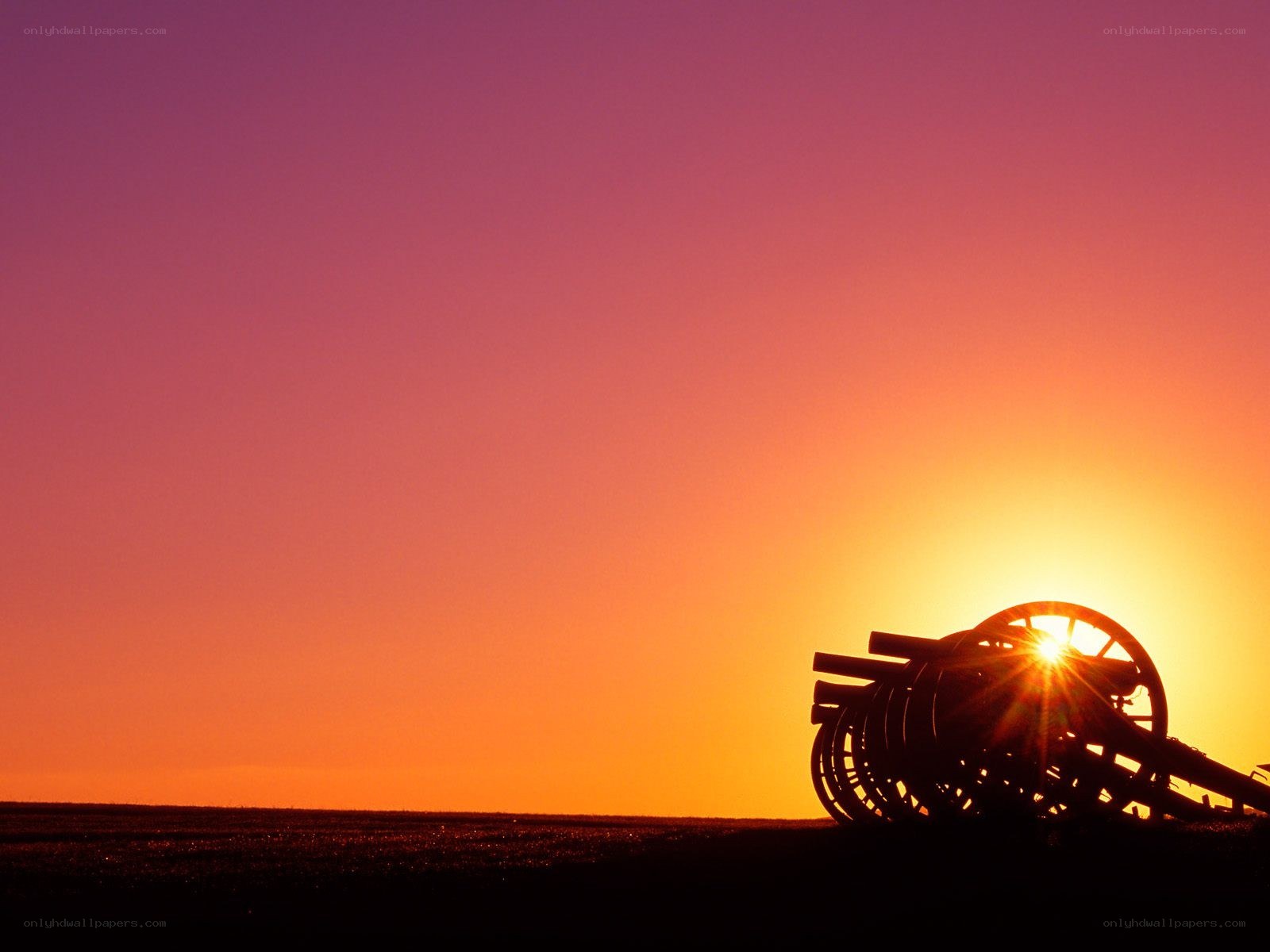 Cannon at sunset silhouette