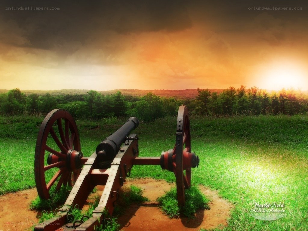 Cannon on a battlefield at sunset
