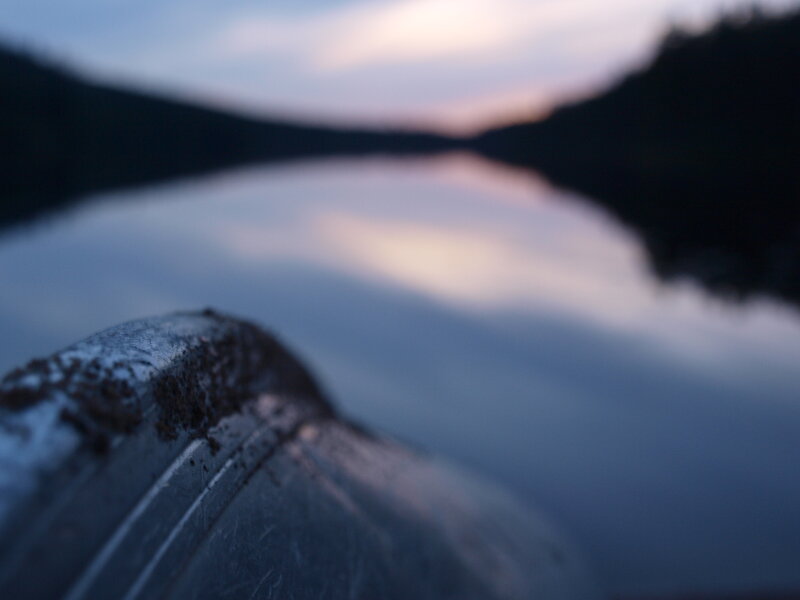 canoe at dusk on a calm lake