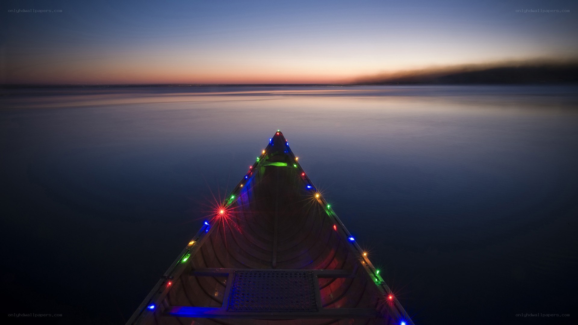 canoe at dusk with lights